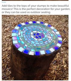 a wooden stump with a mosaic design on it