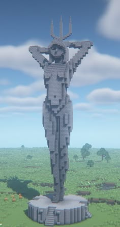 a statue made out of legos in the middle of a field