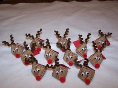 the reindeers are made out of paper and have red noses