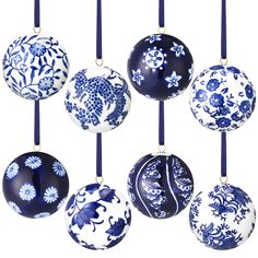 six blue and white ornaments hanging from strings