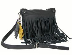 Black Leather Hobo Bag - Medium Crossbody Bag with Fringe and Tassel. This fringed leather handbag made from genuine first class black leather. It is made from high quality leather. This leather bag can be used as a tote and messenger bag. By using the adjustable leather strap you can convert it into a crossbody bag. * Zippered * 1 open pocket inside * Includes internal pockets for mobile phone and other small items. Dimensions: height:21,5 cm (8 in) max width: 28 cm (11 in) strap: max 130 cm (5 Black Hobo Bag With Fringe For Daily Use, Black Fringe Hobo Bag For Daily Use, Black Fringe Hobo Bag For Everyday, Black Fringe Shoulder Bag For Daily Use, Fringe Pouch Bag For Everyday Use, Black Fringe Crossbody Bag, Medium Crossbody Bag, Convertible Tote Bag, Western Bag