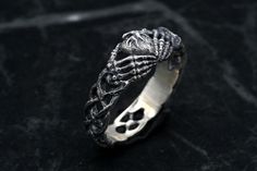 Symbolic Sterling Silver Promise Jewelry, Symbolic Skull Ring For Anniversary, Symbolic Hand-cast Promise Ring, Symbolic Hand Cast Promise Ring, Symbolic Handmade Engraved Promise Ring, Handmade Symbolic Engraved Ring For Promise, Handmade Sterling Silver Engraved Ring For Promise, Gothic Promise Ring Jewelry, Gothic Metal Jewelry For Anniversary