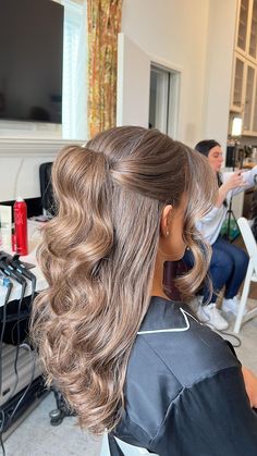 a woman getting her hair done in a salon