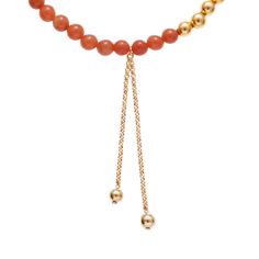 The Negroni necklace from our Aperitivo Collection is both strong and sweet, featuring a drop chain with handcrafted gold-plated beads to add extra flair to your layered necklace look. Crafted with tangerine semi-precious stone beads with intermittent 24K gold-plated brass beads, this tasteful necklace is sure to shine. Measurements: 16 " long, 2 " extension, 3 1/4" drop-down pendant. Materials: Semi-precious stone, 24K gold-plated brass. All Ben-Amun jewelry is handcrafted and made to order in Gold Lariat Necklaces With Gemstone Beads, Gold Lariat Necklace With Gemstone Beads, Elegant Orange Necklaces With Polished Beads, Elegant Amber Necklace With Gold Beads, Yellow Gold Necklaces With Dangling Beads Gift, Yellow Gold Necklaces With Dangling Beads, Yellow Gold Necklace With Dangling Beads For Gift, Yellow Gold Necklace With Dangling Beads As Gift, Yellow Gold Necklace With Dangling Beads