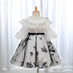 This DreamyVow Elegant White Dubai Girl Dress is perfect for any special occasion. Crafted with quality materials, this dress is both beautiful and comfortable for your little princess. Let her shine at weddings, birthdays, parties, and holidays in this stunning Arabic-inspired gown. Upgrade her wardrobe with 2024 J383. Black Princess Dress For Spring, Black Princess Style Spring Dress, Elegant Ruffled Holiday Dress For Pageant, Elegant Holiday Dress With Ruffles For Pageant, Elegant Ruffled Holiday Dress For Pageants, Elegant Princess Dress For Fancy Dress Occasion, White Long Sleeve Princess Dress For Fancy Dress, Black Princess Gown For Party, Black Princess Dress With Ruffles For Birthday