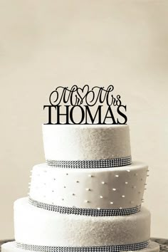 a three tiered wedding cake with the words just married on top