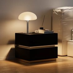 a lamp is sitting on top of a nightstand