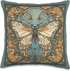 a decorative pillow with an image of a butterfly on the front and back, surrounded by flowers