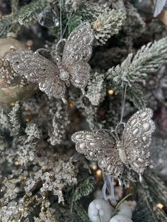 some ornaments are hanging from a christmas tree