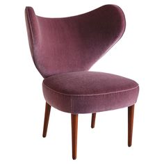 an upholstered purple chair with wooden legs and arm rests on a white background