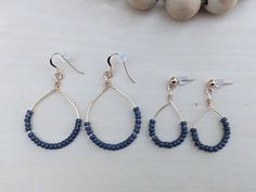 These handmade dangle hoops are made with gunmetal gray seed beads. Against the gold it's a beautiful combination and will go with anything. These beauties are perfect for a special night out or for feeling beautiful on your everyday errands. The perfect gift for yourself or someone you love. Choose between two sizes. Small have a drop of roughly 1.5 inches Large have a drop of roughly 2 inches  Please be aware that these are handmade so no two pairs are exactly alike, slight variances are to be Seed Bead Hoop Earrings, Bead Hoop Earrings, Hippie Earrings, Handmade Jewelry Gift, Beaded Hoop Earrings, Beaded Hoops, Gift For Girlfriend, Earrings Boho, Blue Earrings