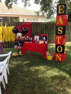 a mickey mouse birthday party in the backyard