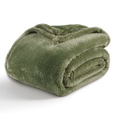 a green blanket folded on top of each other