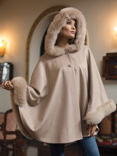 Annika Alpaca Cape: Cream Winter Cape-shaped Faux Fur Coat, Faux Fur Winter Cape Coat, Winter Poncho With Faux Fur Trim, Elegant Faux Fur Winter Cape, Winter Faux Fur Poncho With Trim, Winter Faux Fur Cape Coat, Elegant Hooded Faux Fur Outerwear, Luxury Cape With Faux Fur Trim, Luxury Winter Poncho