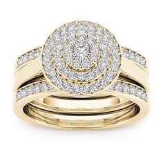 a yellow gold ring set with two matching bands and a round diamond in the center