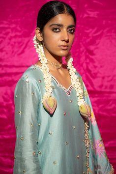 Mint chanderi silk kurta with sequin, pearl placement embroidery. Paired with floral print sharara and fringe bordered dupatta.
Components: 3
Pattern: Printed, Embroidery
Type Of Work: Floral, sequin, pearl
Neckline: Scallop V neck
Sleeve Type: Long sleeves
Fabric: Chanderi Silk, Lining: Shantoon
Color: Green,Blue
Other Details: 
Fringe tassel bordered dupatta
Length:
Kurta: 35 inches
Sharara: 38 inches
Note: Potli shown in the image is not for sale
Occasion: Sangeet - Aza Fashions Floral Print Sharara, Placement Embroidery, Printed Embroidery, Kurta Set For Women, Silk Kurta, Tassel Fringe, Kurta Set, Embroidered Silk, Set For Women