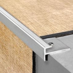 a close up view of the bottom section of a sliding door with an aluminum frame