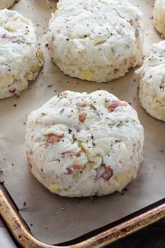 some biscuits are sitting on a baking sheet