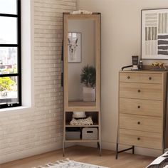 a bedroom scene with focus on the dresser, mirror and chest of drawers in the foreground