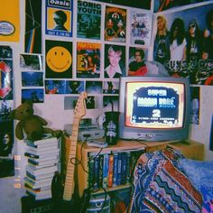 a room filled with posters and a television