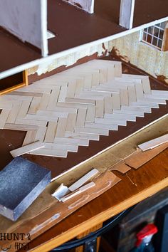 an unfinished piece of wood sitting on top of a table