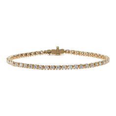 Turn heads with this stunning lab-grown diamond tennis bracelet. Set in warm 14-karat yellow gold  all the diamonds in this classic bracelet design are hand-matched for consistent color  clarity  and sparkle. A secure box clasp offers worry-free daily wear. Classic Gold Bracelet With Round Cut Cubic Zirconia, Classic Gold Bracelet With Cubic Zirconia Round Cut, Classic Yellow Gold Diamond Bracelet With Prong Setting, Classic Yellow Gold Tennis Bracelet With Single Cut Diamonds, Classic Yellow Gold Diamond Cut Tennis Bracelet, Classic Yellow Gold Tennis Bracelet With Diamond Accents, Classic Gold Bracelet With Diamond Accents For Luxury, Classic Yellow Gold Tennis Bracelet For Formal Events, Classic Gold Diamond Bracelet With Prong Setting