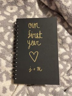 a notebook with writing on it that says our first year