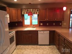 an empty kitchen with wooden cabinets and white appliance in the center, on tile flooring