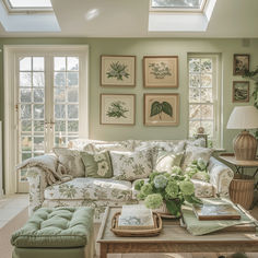 a living room filled with furniture and lots of windows