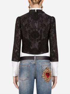 Dolce & Gabbana is your calling card if you're looking for feminine romance. The eye drawn to ornate embellishments, exquisite flower motifs, and look-at-me lace. This statement-making Cropped Stretch-Tulle Taffeta Jacket made in Italy from a black stretch silk-cotton blend has slim fit, length, asymmetric neckline, sleeves, floral lace pattern, built-in sheer corset. Luxury Floral Embroidery Formal Outerwear, Luxury Floral Embroidered Formal Outerwear, Luxury Formal Outerwear With Floral Embroidery, Luxury Fitted Outerwear With Intricate Embroidery, Elegant Silk Outerwear With Intricate Embroidery, Elegant Embroidered Silk Outerwear, Elegant Silk Outerwear With Embroidery, Elegant Party Outerwear With Intricate Embroidery, Silk Outerwear With Intricate Embroidery