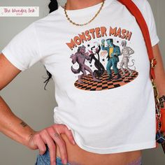 This retro Monster Mash baby tee is perfect for Halloween season! This classic baby tee will fit like a well-loved favorite from its first wear. These stylish Gildan 5000B tees feature: 💕 Made with 100% US cotton that feels soft to the touch and a great choice for any season (Heather colors - 50% cotton, 50% polyester,  Sport Grey - 90% cotton, 10% polyester) 💕 The crew neckline along with the tee's classic fit, deliver a timeless style that is perfect for daily use. 💕 All t-shirts come with White Grunge T-shirt For Halloween, White Custom Print Grunge Tops, White Grunge Custom Print Tops, White Grunge Tops With Custom Print, White Grunge Style Top With Custom Print, White Grunge Top With Custom Print, White Grunge Tops For Halloween, Retro Halloween T-shirt With Character Print, Pop Culture Tops For Halloween Streetwear