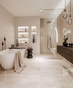 a bathroom with a large tub, sink and shower in the middle of it's walls