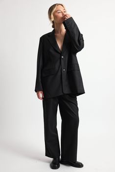 Our Oversized Double Button Blazer combines classic tailoring with contemporary flair. It features a timeless double button closure. Pair it with our Adjustable Waist Trousers for an effortless look. Oversized Business Blazer With Double Button Closure, Oversized Black Outerwear With Double Button Closure, Black Structured Single Button Blazer, Sleek Black Single-button Blazer, Black Structured Single-button Blazer, Contemporary Wardrobe, Blazer Buttons, Wardrobe Staples, Best Sellers