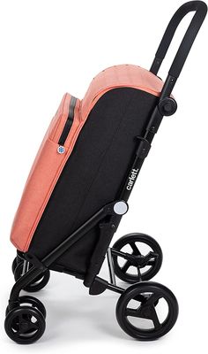 an orange and black stroller with wheels on it's side, against a white background