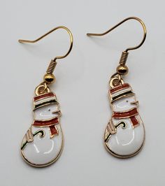 Add a festive touch to your holiday outfit with these Christmas Snowman fishhook earrings! 🎄✨ Handmade with care, these dangle earrings are perfect for the Christmas season. #ChristmasEarrings #HolidayJewelry #Handmade #FestiveFashion #SnowmanEarrings  #eBay #eBayStore #eBaySeller #Christmas #Earrings Xmas Jewelry, Whimsical Snowman, Fishhook Earrings, Snowman Design, Fish Hook Earrings, Holiday Outfit, Holiday Jewelry, Fashion Jewelry Earrings, Christmas Earrings