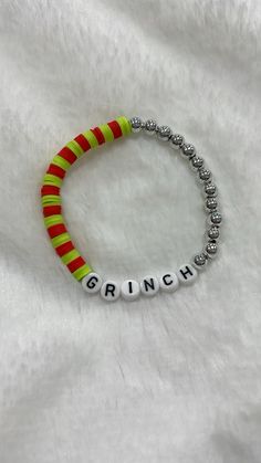 a bracelet with the word grin written on it