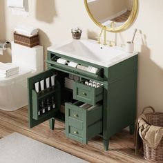 a bathroom with a sink, mirror and green cabinet in the middle of the floor