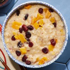 a bowl of oatmeal with fruit on top