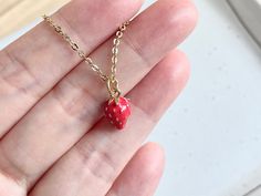 These dainty strawberry necklaces are made of the followings: (1) Gold plated strawberry charm (size: 12 x 8 mm) (2) Gold plated necklace chain ✏️ Please choose your desired color of strawberry charm ✏️ Please choose the length of the chain (the length includes clasp and findings). ❣️ If you are unsure about which length to choose , please leave me a note to request an extension chain to be added to the chain at check out. 🍓 MORE STRAWBERRY NECKLACE 🍓 → https://www.etsy.com/listing/666509218 → Cute Red Charm Necklace For Gift, Cute Red Charm Necklaces For Gifts, Dainty Enamel Necklace As A Gift, Small Red Jewelry Perfect For Gifting, Small Red Jewelry For Gift, Valentine's Day Gift Enamel Charm Necklaces, Valentine's Day Gift Enamel Charm Necklace, Dainty Tiny Red Jewelry, Cute Enamel Necklaces For Gifts