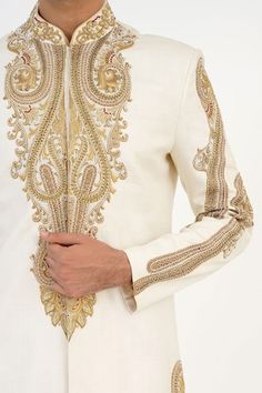 Ivory matka silk sherwani with dabka, beads and french knots hand embroidered motifs. Comes with churidar and a kurta. - Aza Fashions Traditional Fit Sherwani With Intricate Embroidery For Diwali, Traditional Fit Sherwani With Resham Embroidery For Festivals, White Dabka Sherwani Traditional Fit, Diwali Sherwani With Intricate Embroidery Traditional Fit, Bollywood Style Ceremonial Sherwani With Traditional Fit, Cream Churidar With Resham Embroidery For Reception, Off White Dabka Kurta For Reception, Embroidered Traditional Fit Sherwani For Wedding, Raw Silk Bandhgala With Cutdana For Reception