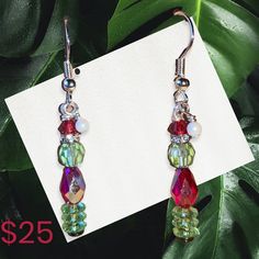 You're a mean one Mr Grinch! These delightful festive earrings are made from Swarovski crystals and represent that rascally Grinch. A conversation starter to be sure this holiday season. Hypoallergenic ear wires. 1" long. Single Crystal Earring As A Gift, Party Earrings With Czech Glass, Dangle Wire Wrapped Crystal Earrings For Party, Christmas Beaded Dangle Earrings, Party Czech Glass Crystal Earrings With Ear Wire, Dangle Crystal Earrings With Czech Glass For Gift, Christmas Beaded Drop Earrings, Holiday Dangle Earrings, Party Czech Glass Drop Earrings