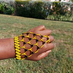 100 % Hand made. This Zulu beaded glove is also a Zulu love letter. Depending on the colors. Makes a great gift for Brides or Girlfriend. It adds a spark to any outfit. It is 8.5 inches long fits most adults . Zulu Head Gear, Festival Beaded Bracelets With Black Beads, Unique Yellow Beaded Bracelets For Festival, Beaded Wristlet Gift, Hand Wrapped Beads For Gift, How To Make Gloves, South African Jewelry, African Beaded Bracelets, Beaded Gloves