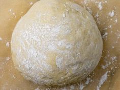 a ball of dough sitting on top of a table