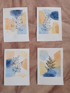 four watercolor paintings with leaves on them