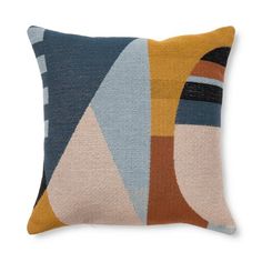 a pillow with an abstract design on the front and back, in blue, yellow, brown