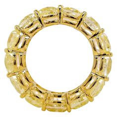 Eternity Band comprised of 13 GIA-Certified Cushion-Cut Fancy Light Yellow Diamonds on an 18 Karat Yellow Gold Band. 13.21 carats of Natural Fancy Light Yellow Diamonds from Scarselli form an elegant eternity band, fashioned with 18K yellow gold. Ring is resizable upon request. A clean, classic eternity band from Scarselli Diamonds. It offers a very timeless look that fits into the current trend of stackable rings. Symbolizing a commitment to love, eternity bands are usually given as a gift to c Light Yellow Diamond, Grand Pianos, Fancy Light, Baby Grand Pianos, Fancy Lights, Yellow Diamonds, Diamond Eternity Band, Eternity Rings, 18k Yellow Gold Ring