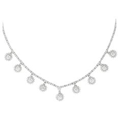 Exquisite dangling round brilliant diamond necklace. High jewelry by Alexander Beverly Hills. 12.76 carats total diamond weight. 9 round brilliant diamonds 4.56ct. 344 round diamonds, 8.20 carats. Approximately G/H color and SI clarity. Prong set in 18k white gold, 16in. Accommodated with an up-to-date digital appraisal by a GIA G.G. once purchased, upon request. Please contact us with any questions. Thank you. Item Number N6169 Diamond High Jewelry, High Jewelry Necklace, Modern Diamond Jewelry, White Diamond Jewelry, Modern Necklaces, Handcrafted Necklace, Women Diamond, Drop Necklace, Brilliant Diamond