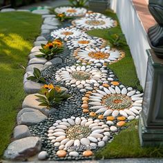 a garden path made out of stones and flowers