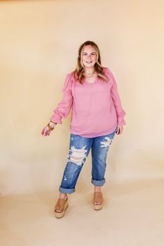 This Casually Stunning V Neck Long Sleeve Blouse brings effortless elegance to any wardrobe. Crafted in sheer fabric with a lining, this stylish blouse features a flattering V neckline and long sleeves with ruffle detail. The mauve pink hue makes it an eye-catching yet sophisticated style. Pair it with Judy Blue Jeans and sandals for a Spring season look! Arté is wearing a size small. Abby is wearing a size large. Size Measurements: Small: Bust: 20 inches across the front | Length: 25 inches Med Chic Long Sleeve Chiffon Blouse, Flowy Long Sleeve Chiffon Blouse, Chiffon Blouse For Brunch In Fall, Fall Chiffon Blouse For Brunch, Chiffon Long Sleeve Blouse For Brunch, Pink Long Sleeve Blouse With Sheer Sleeves, Feminine Blouse With Sheer Long Sleeves, Flowy Long Sleeve Tops With Sheer Sleeves, Sheer Long Sleeve Tops For Brunch