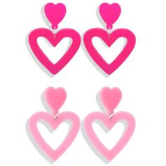 three pairs of pink heart shaped earrings with dangling ear hooks on top of each other